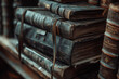 A stack of old books with a worn leather binding