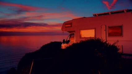 Sticker - Camper rv camping on beach sea shore at sunrise. Adventure, travel with mobile home to Spain in wintertime.