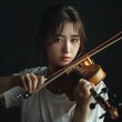Asian Female violin player performing music on stage. Experienced asian violin player having solo concert, on black background