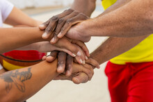 Basketball Anonymous Teammates Place Their Hands Together In A Symbol Of Unity And Shared Commitment Before Starting Their Street Basketball Session