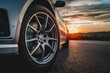 Tire close up with sunset backdrop creates dramatic automotive image