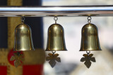 Fototapeta Desenie - Small golden bell hung for Buddhists.