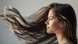 © AndyPhoton - Portrait of a Woman with Long Brunette Hair. Wind-Blown in Close-Up Profile