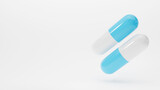 Fototapeta Sypialnia - Falling blue and white pills capsule on white background. 3D rendered banner.