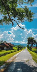 Wall Mural - a sunny day in the Malaysia countryside with blue skies, green meadows and wooden farm buildings on one side of an asphalt road leading to village houses.  illustration made with Generative Ai