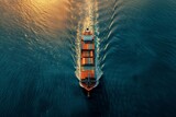 Fototapeta  - Aerial top down view of a large container cargo ship in motion over open ocean with copy space