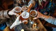 © Syahrul Zidane A - Group of happy friends having fun while toasting with beer in a bar.