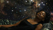 A serene black woman reclines on a bed of stars her rich skin bathed in the gentle glow of the celestial fabrics dd across her body representing the enigmatic and alluring nature of .