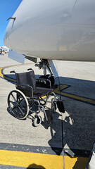 Wheelchair Attached to Wing of Airplane