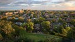© Justlight - A panoramic shot of a citys residential neighborhoods featuring rows of houses and apartment buildings. Parks playgrounds and green spaces can also be seen providing a balance
