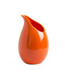 An orange ceramic water jug designed in the style of Jacquemus, transparent background