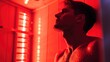 © Evon J - Boy with serene expression enjoying red light therapy.