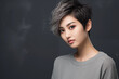 © gaukharyerk - Studio portrait of beautiful asian woman with short hair style on colour background