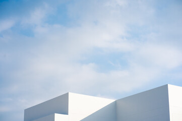 Wall Mural - architecture and landscape concept with white building with cloudy sky background
