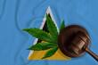 Gavel and cannabis leaf on the Saint Lucia flag - legalization of marijuana in the country