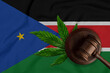 Cannabis and judges gavel on the Republic of South Sudan flag background. Medical cannabis concept.