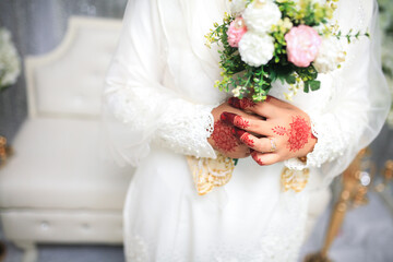 Wall Mural - Beautiful wedding bouquet in hands of the bride. Trendy and modern wedding flowers.