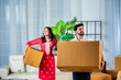 © StockImageFactory - home shifting or moving concept, Indian young couple with cardboard cartons or boxes