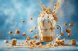 A tall glass mug of caramel milkshake with white cream and a straw, sprinkled with brown sugar candy on the bottom, against a blue background