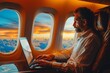 Businessman working on his laptop sitting in business class of flying airplane