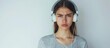 A woman looking sad wearing headphones