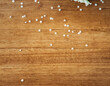 Top view of little white elderflowers on a wooden background. Aerial view of white little elder or elderberry flowers on a table show that spring time is coming and elderflower cordial can be made