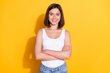 Sticker - Photo portrait of attractive young girl crossed hands confident wear trendy white outfit isolated on yellow color background