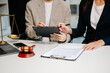 © laddawan - Business law concept, Lawyer business lawyers are consulting lawyers for women entrepreneurs to file copyright lawsuit with laptop and tablet