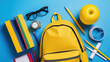 Bright Yellow School Bag Laden with Educational Gear against a Blue Backdrop