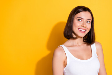 Sticker - Photo portrait of attractive young girl look excited empty space wear trendy white outfit isolated on yellow color background