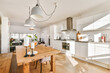 © ADDICTIVE STOCK - Modern kitchen and dining area with natural light