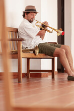 Practicing Trumpeter In A Casual Home Setting