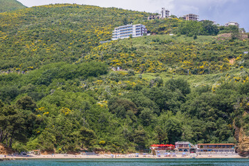 Wall Mural - View from the sea on Mogren beach in Budva town, Adriatic coast, Montenegro