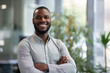 © Volodymyr - Confident African American professional in office environment smiling at camera