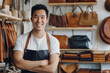 Smiling young Asian man standing in his leather store. Entrepreneur, business owner and SME concept