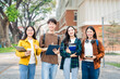 Diverse group of young adults from Asia and beyond, enjoying university life together. happy, learning, and making lifelong friendships, whether in outside class, sunny summer days or cozy weekends