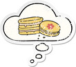 © lineartestpilot - cartoon biscuit with thought bubble as a distressed worn sticker
