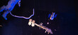 Panorama astronaut with safety umbilical cord tethers spacewalk walking round space station, integrated truss structure, orbit Earth and galaxy hanging on ceiling of museum in Texas