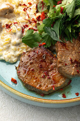 Canvas Print - Portion of beef medallions and garnish with mushrooms