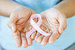 woman with Pink ribbon for patients with breast and cervical cancer