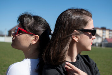 Close up portrait of a two young women in sunglasses	