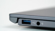 Closeup of a USB port on a grey laptop