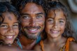 A smiling man with curly hair posing with two joyful young girls, evoking family happiness and bonding. 