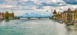 Large panorama of the Rhine Bridge (Rheinbrücke) at Constance with the two medieval towers Rheintorturm and Pulverturm. The bridge spans the Seerhein, a river in the basin of Lake Constance.