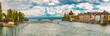 Huge panorama of the Rhine Bridge (Rheinbrücke) crossing the river Seerhein at Constance with the Alps behind and the two medieval towers Rheintorturm and Pulverturm.