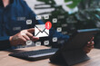 © NongAsimo - Notifications, emails, and new messages in the mailbox, New email warning sign concept, Businessman use tablet check new email, Data digital marketing communication, Online working internet network