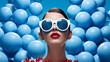 a model wearing light blue sunglasses in a field of light blue balls, in the style of bold and graphic compositions, bold fashion photography