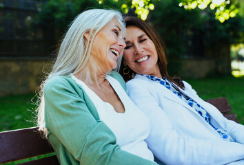 Beautiful senior women meeting outdoors in the city