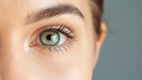 Fototapeta Panele - Close-Up of Woman's Green Eye on Dark Background