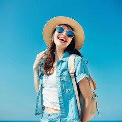 Joyful adventurer in summer attire ready for a holiday excursion against a clear blue sky